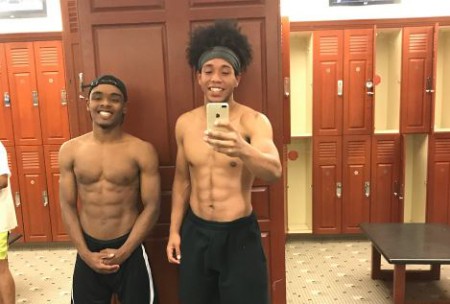 Emmanuel Lateju with a friend showing his physique